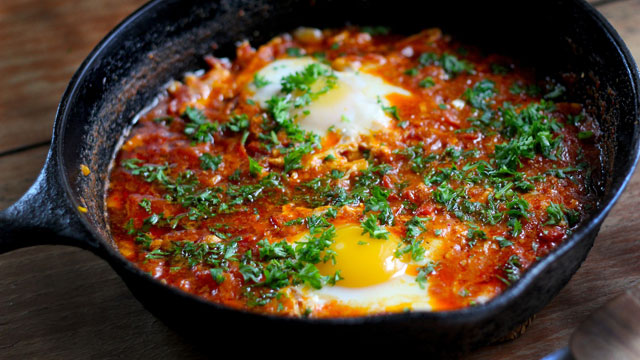 Chakchouka eggs poached in spiced tomato sauce - traditional Tunisian breakfast
